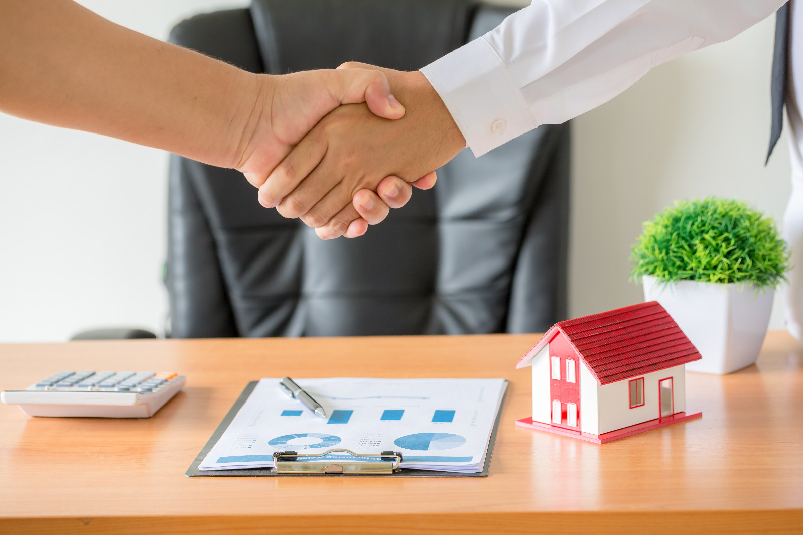 hands-agent-client-shaking-hands-after-signed-contract-buy-new-apartment